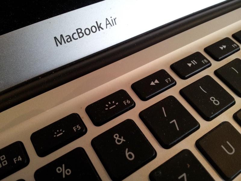 A close up photo of a MacBoook Air. This Apple laptop was model A1466 EMC3178 and the keyboard and screen are clearly shown.