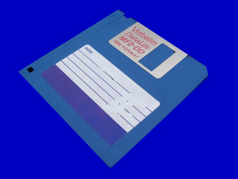 A floppy disk containing old MacWrite word processor files from an Apple OS7 computer.