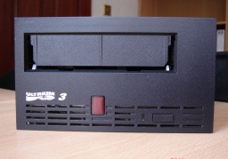 An LTO Ultrium tape drive front face in black used to read LTO1, LTO2 and LTO3 data cartridges and save files to a hard drive.