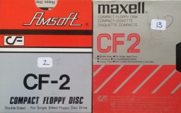 There are 2 CF2 disks made by Amsoft (Amstrad) and Maxell. These disks were sent to be converted to Microsoft Word and are pictured side by side. The discs are still in their original cardboard outer sleeves.