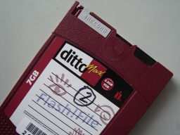 A Ditto Max tape cartridge made by Iomega, including Flash-File logo. Later these tapes were made by Tecmar, but we can recover the files from them. We can also re-attached the tapes when they have become de-spooled from the reel.