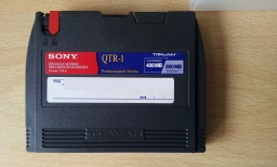 A Sony mini data cartridge QTR-1 Travan tape awaiting file transfer to usb.