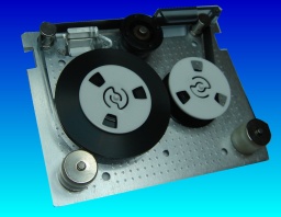 A QIC-80 tape cartridge with it's outer case removed exposing the tape reel mechanisms. These small tapes were often used in HP Colorado Backup, Windows 95, 98 backups, Seagate and Backpack we have been able to recover the files even when the password was forgotten or the drive belt snapped.